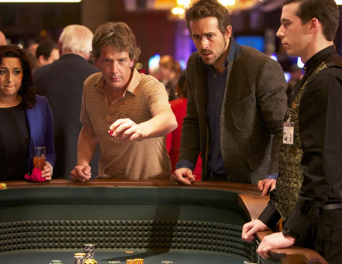 Ryan Reynolds & Ben Mendelsohn at casino table